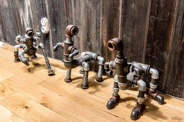 casa 5 mascotas hechas con secciones de cañerías tipo loft paredes ladrillo visto