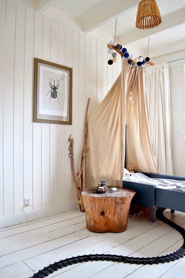 idea para crear un dosel con una rama decoración infantil