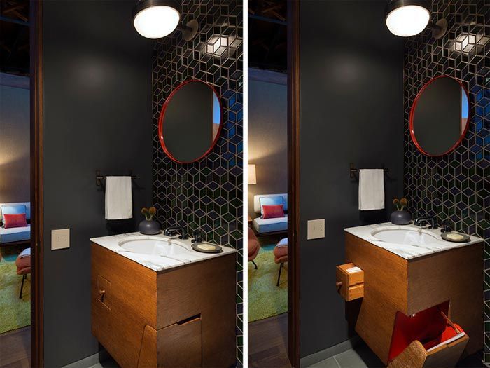 bano-decorado-tonos-oscuros-azulejos-asimetricos-espejo-rojo
